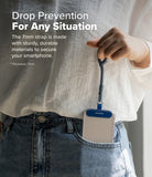 Holder Link Flow Finger Ring - A hand holds a blue phone strap attached to a smartphone case tucked into a denim pocket.
