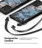 Galaxy S10 Lite Case | Fusion-X - Two camouflage phone cases with black bumpers and detachable black lanyard straps attached.