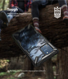 Galaxy S10 Lite Case | Fusion-X - Camouflage phone case with military-grade drop protection against a blurred forest background.