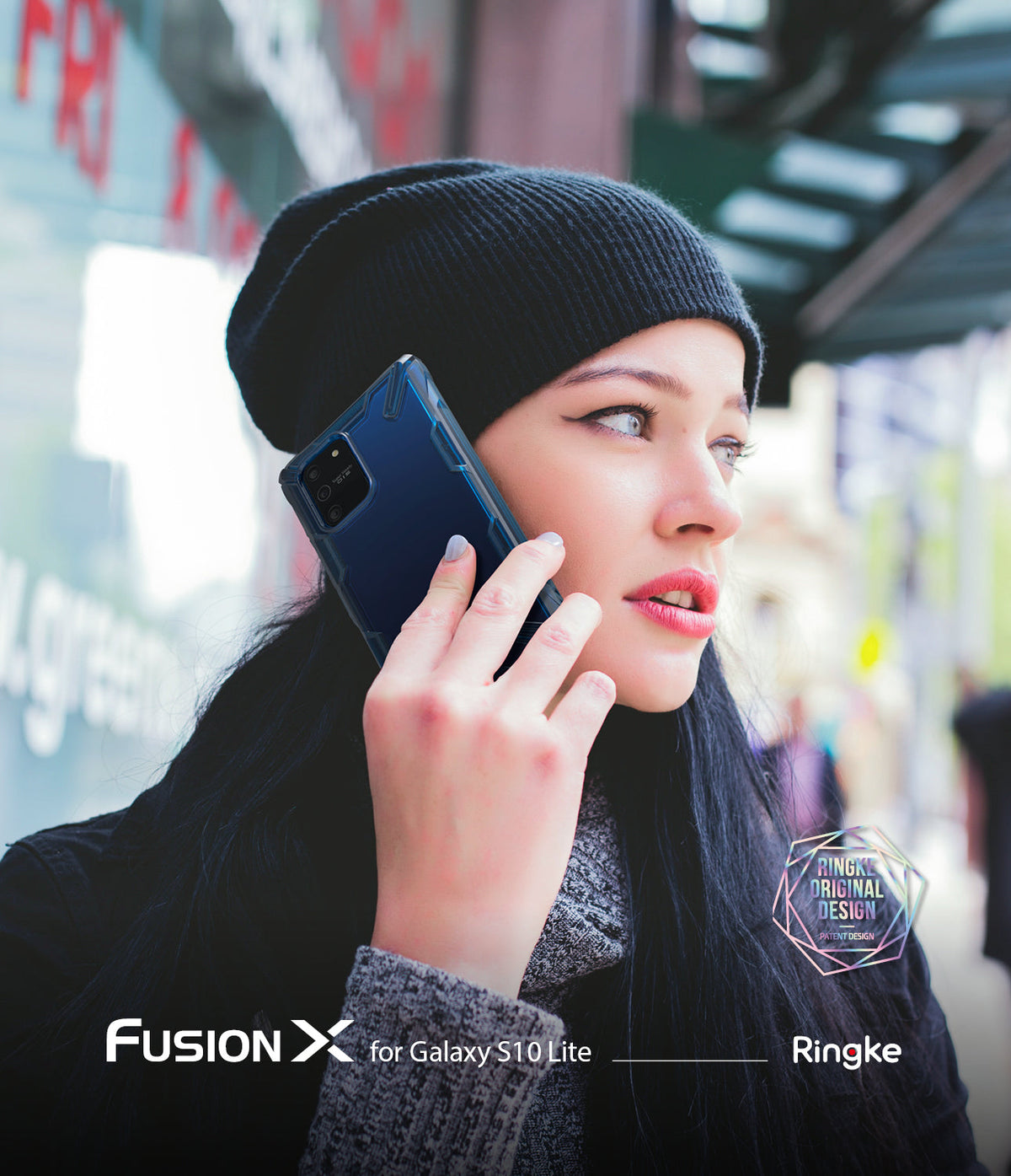Galaxy S10 Lite Case | Fusion-X - Woman in a black beanie talking on a Galaxy S10 Lite with a blue Fusion-X protective case.
