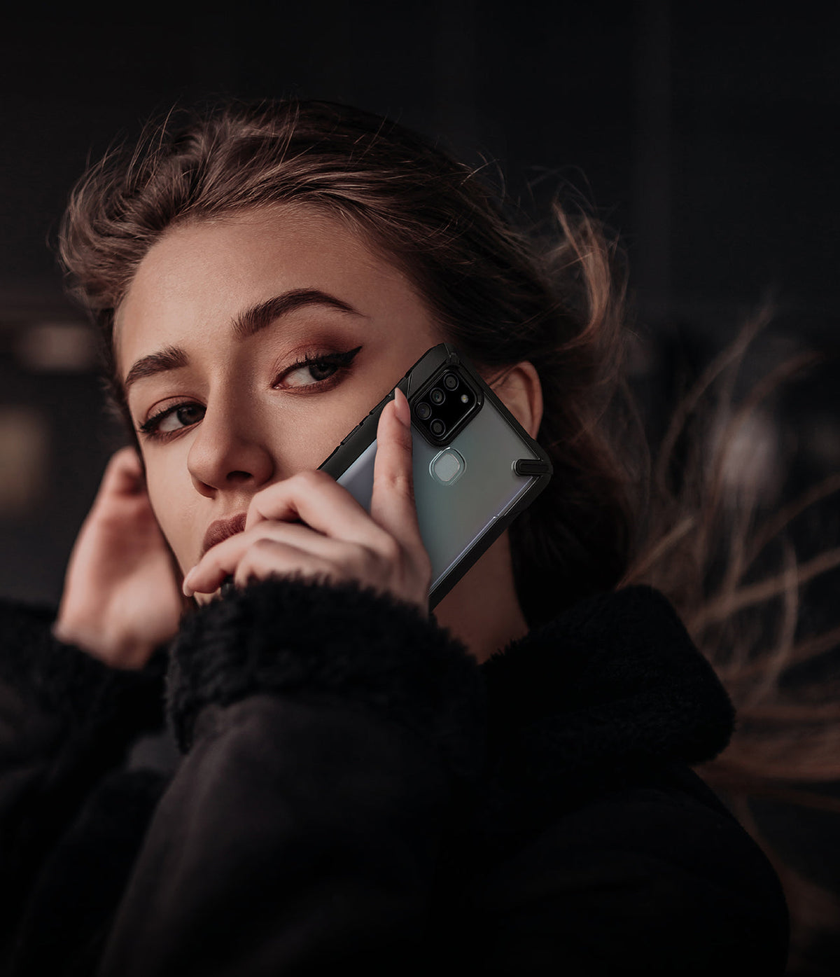 Galaxy A21s Case | Fusion-X - Woman holding a Galaxy A21s in a black Fusion-X protective case against her ear.