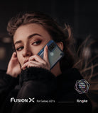 Galaxy A21s Case | Fusion-X - Woman holding a Galaxy A21s in a clear Fusion-X protective case against her ear.