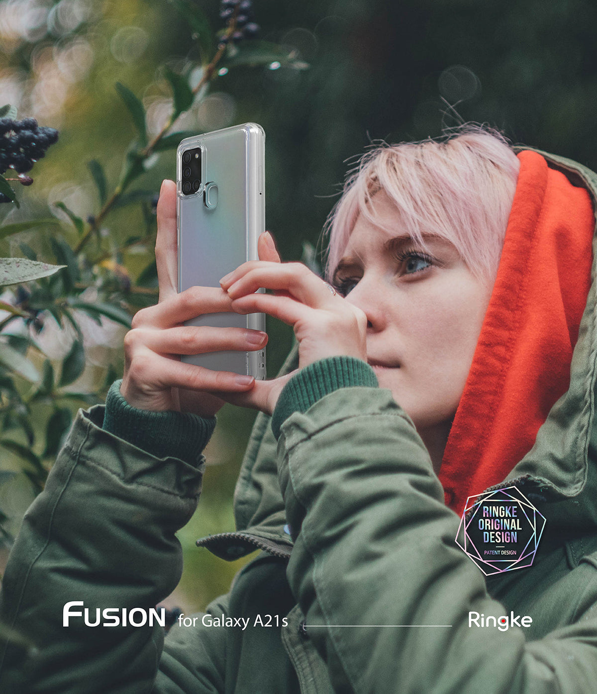 Galaxy A21s Case | Fusion - Person with pink hair in a green jacket holding a clear phone case outdoors.