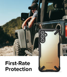 Galaxy A34 Case | Fusion-X - A rugged black phone case with a gradient back, shown next to a person in an off-road vehicle.