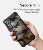 Galaxy A34 Case | Fusion-X - Hand holding a Galaxy A34 with a black, camo-patterned Fusion-X case featuring a secure, ergonomic grip.