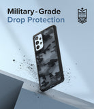 Galaxy A53 5G Case | Fusion - Camo-patterned phone case floating with debris, featuring military-grade drop protection text.