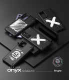 Galaxy A72 Case | Onyx Design - Four black phone cases with white graphic prints arranged on a dark surface.