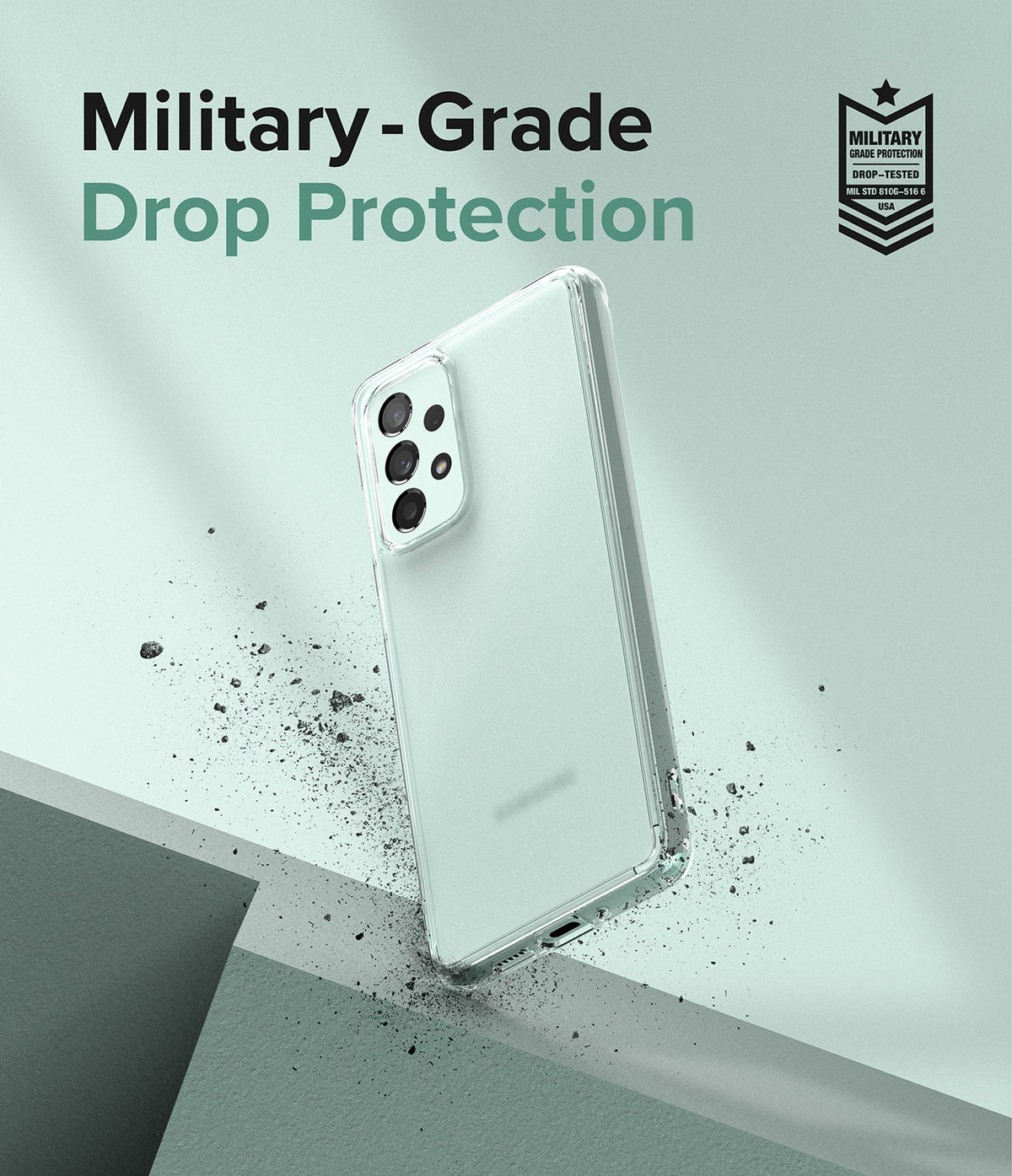 Galaxy A73 5G Case | Fusion - Clear phone case floating above a surface with debris, featuring military-grade drop protection text.