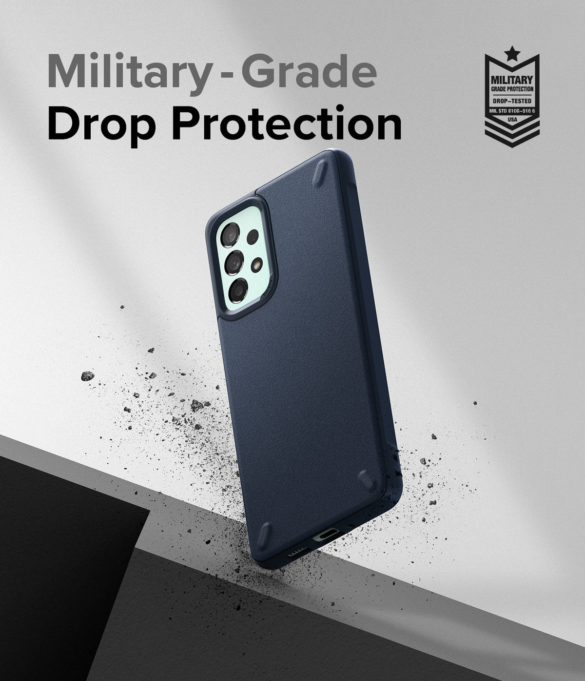 Galaxy A73 5G Case | Onyx - Navy blue phone case floating above a surface with debris, featuring military-grade drop protection.