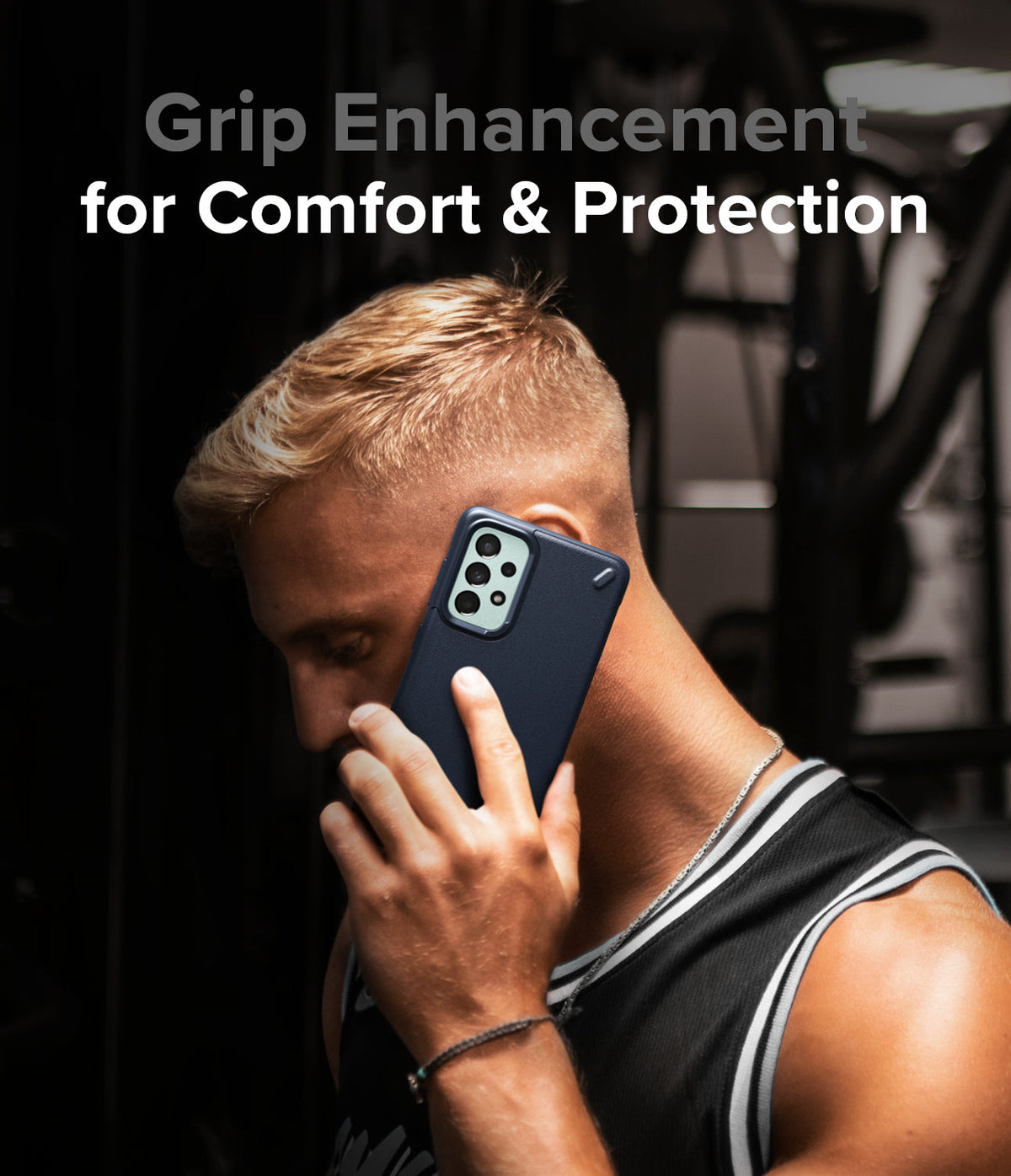 Galaxy A73 5G Case | Onyx - Man holding a dark blue phone case to his ear in a gym setting with text overlay.