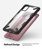 Galaxy A71 Case | Fusion-X - Clear phone case with black rugged TPU bumper hovering over a pink Samsung Galaxy A71.
