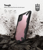 Galaxy A71 Case | Fusion-X - Black protective phone case with clear back, shown amidst flying dirt and debris.