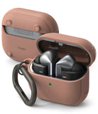 Galaxy Buds 3 Pro / 3 / 3 FE | Onyx Magnetic - Metallic earbuds in an open, textured rose-gold case with a carabiner.