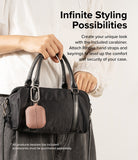 Galaxy Buds 3 Pro / 3 / 3 FE | Onyx Magnetic - A pink earbud case attached to a black handbag with a silver carabiner.
