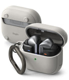 Galaxy Buds 3 Pro / 3 / 3 FE | Onyx Magnetic - Silver metallic earbuds in an open, textured light gray protective case.
