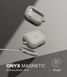 Galaxy Buds 3 Pro / 3 / 3 FE | Onyx Magnetic - Two gray textured earbud cases floating above a magnetic wireless charger.