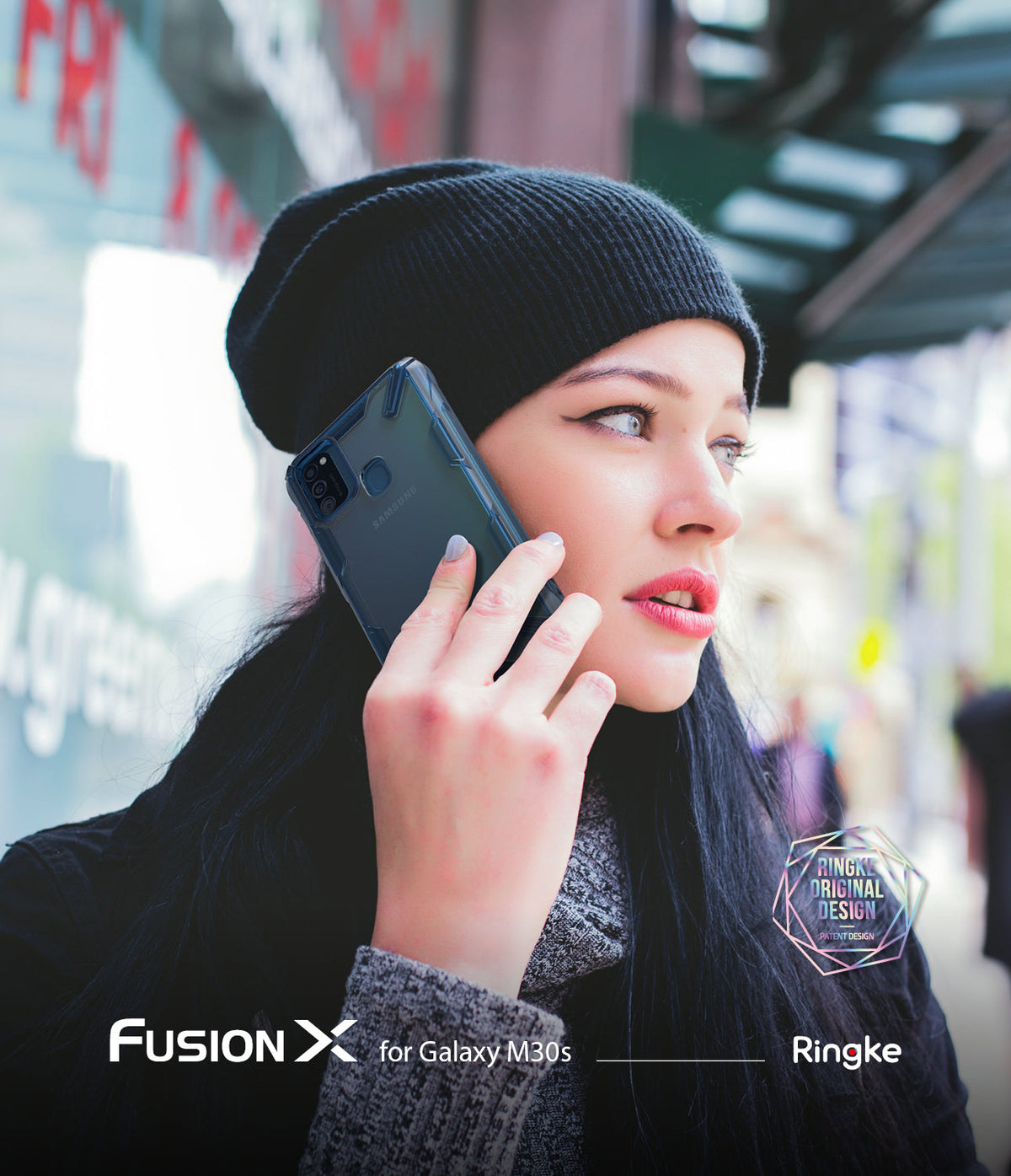 Galaxy M30S / M21 Case | Fusion-X - Woman in a black beanie holding a Samsung phone with a dark Fusion-X protective case.
