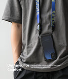 Galaxy M51 Case | Fusion-X - A phone in a black protective case hanging from a blue neck lanyard against a gray shirt.