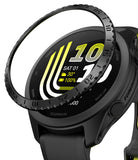 Forerunner 165 / 170 / 70 Bezel Styling | Bezel Styling - A close-up of a black Garmin smartwatch with a sport band, shown with a circular black ring accessory partially covering the watch face. The watch has a black bezel, black case, and a black strap with small yellow accents.