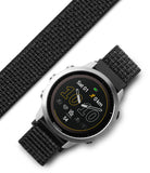Forerunner 955 | Bezel Styling - Silver Garmin Forerunner 955 smartwatch with a black textured nylon strap on a white background.
