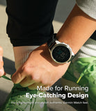 Forerunner 955 | Bezel Styling - Forerunner 955 - A white Garmin watch with a black strap worn on a wrist while tying green running shoes.