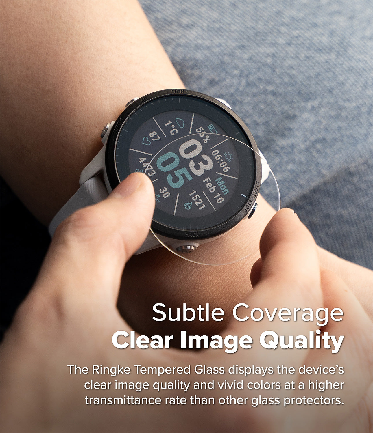 Forerunner 955 Screen Protector | Glass - R6 - Hand applying a clear tempered glass screen protector to a Garmin smartwatch.