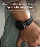 Forerunner 965 | Bezel Styling & Band - Forerunner 965 - A black Garmin watch with a textured fabric sports air loop strap worn on a person's wrist.