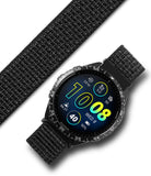 Forerunner 965 | Bezel Styling & Band - Forerunner 965 - Garmin smartwatch with a textured black nylon band and a digital watch face showing 10:08 in neon colors.