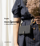 Galaxy Note 20 Ultra Case | Folio Signature Black - Person wearing a pinstripe dress holding a black leather folio case.