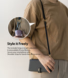 Galaxy Note 20 Ultra Case | Folio Signature Black - Person wearing a black crossbody phone case with an adjustable strap.