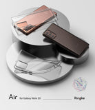 Galaxy Note 20 Case | Air - Two Galaxy Note 20 phones and a clear protective case arranged on metallic circular pedestals.