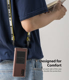 Galaxy Note 20 Case | Fusion Design - A phone in a protective case hanging from a yellow and black branded lanyard.