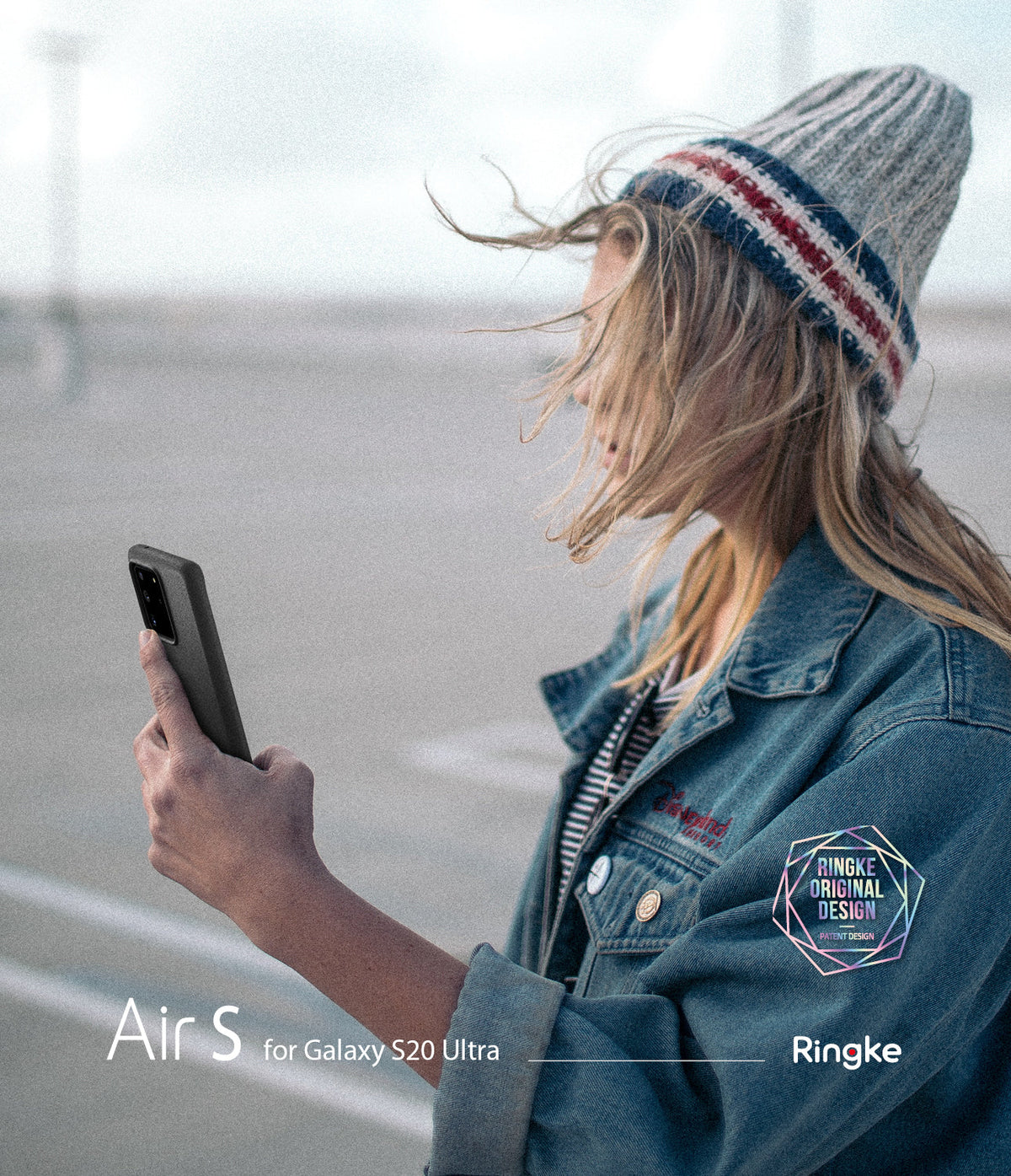 Galaxy S20 Ultra Case | Air-S - Woman in a beanie and denim jacket holding a black Galaxy S20 Ultra in an Air-S case.