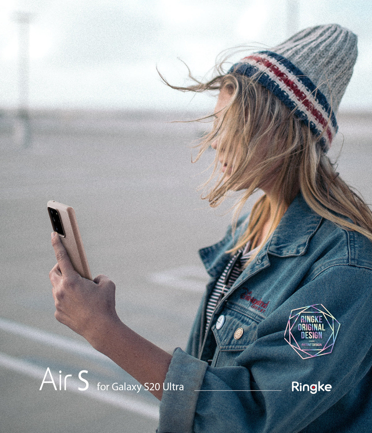 Galaxy S20 Ultra Case | Air-S - Woman in a beanie and denim jacket holding a beige Galaxy S20 Ultra phone outdoors.