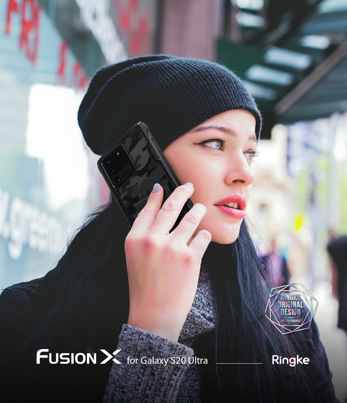 Galaxy S20 Ultra Case | Fusion-X - Woman in a beanie holding a black camouflage phone case to her ear outdoors.