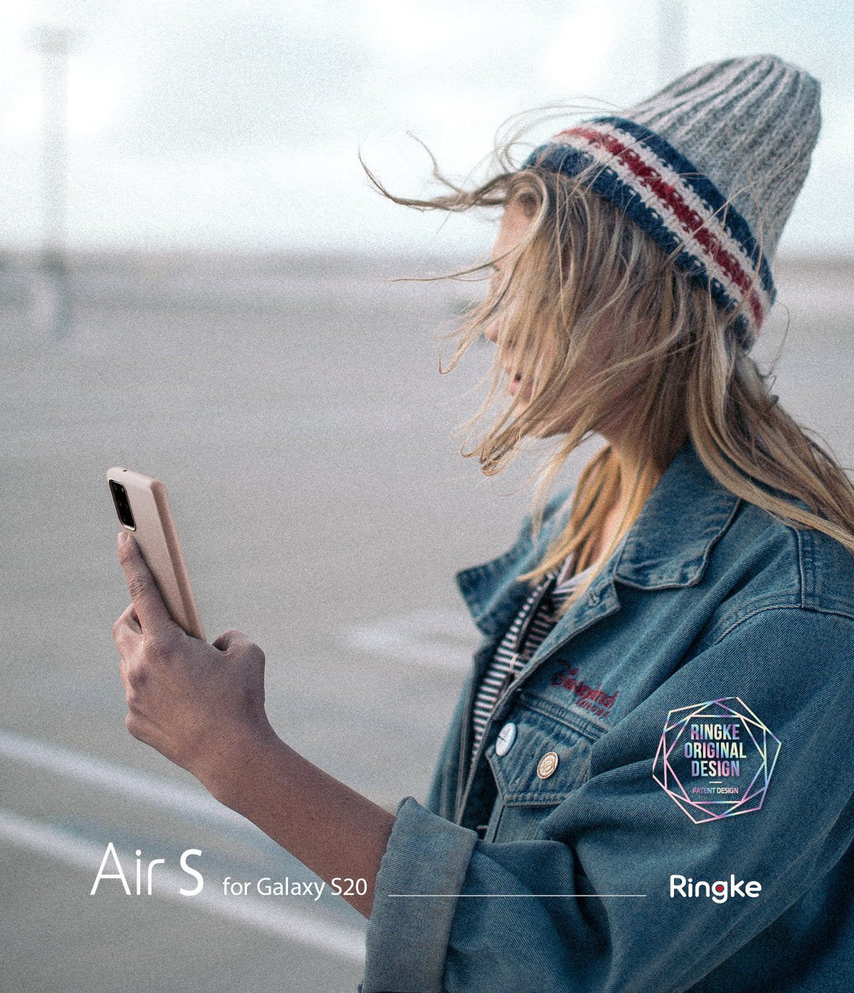 Galaxy S20 Case | Air-S - Woman in a beanie and denim jacket holding a beige Galaxy S20 phone outdoors.