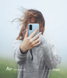 Galaxy S20 Case | Air - Person holding a light blue Galaxy S20 in a clear case, obscuring their face in a misty setting.