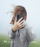 Galaxy S20 Case | Air - A person in a grey hoodie holds a black Galaxy S20 phone in a thin case, obscuring their face.