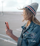Galaxy S20 Plus Case | Air-S - Woman in a beanie and denim jacket holding a coral-colored Galaxy S20 Plus phone.
