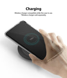 Galaxy S20 Plus Case | Fusion Design - Hand holding a phone in a clear case wirelessly charging on a black pad.