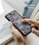 Galaxy S21 FE Case | Fusion - Hand holding a camo-patterned phone case with a satin finish and shock-resistant design.
