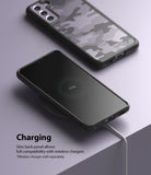 Galaxy S21 FE Case | Fusion - Phone with camo case charging wirelessly on a pad next to another phone in the same case.