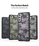 Galaxy S21 FE Case | Fusion - Four Galaxy S21 FE phones in black cases with various camouflage patterns and colored camera modules.