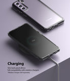 Galaxy S21 FE Case | Fusion - A clear phone case on a Galaxy S21 FE charging wirelessly on a pad against a purple background.