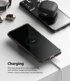 Galaxy S21 Plus Case | Fusion - Smartphone in clear case wirelessly charging with earbuds on its back panel.