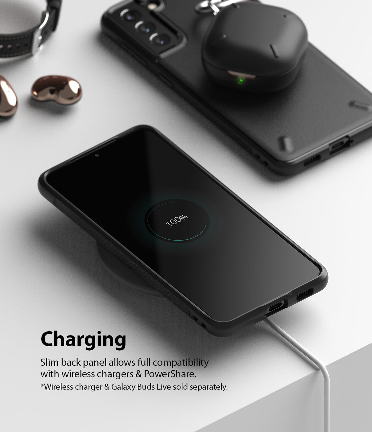 Galaxy S21 Plus Case | Onyx - Black phone case on a wireless charger showing 100% battery, with earbuds charging on top.
