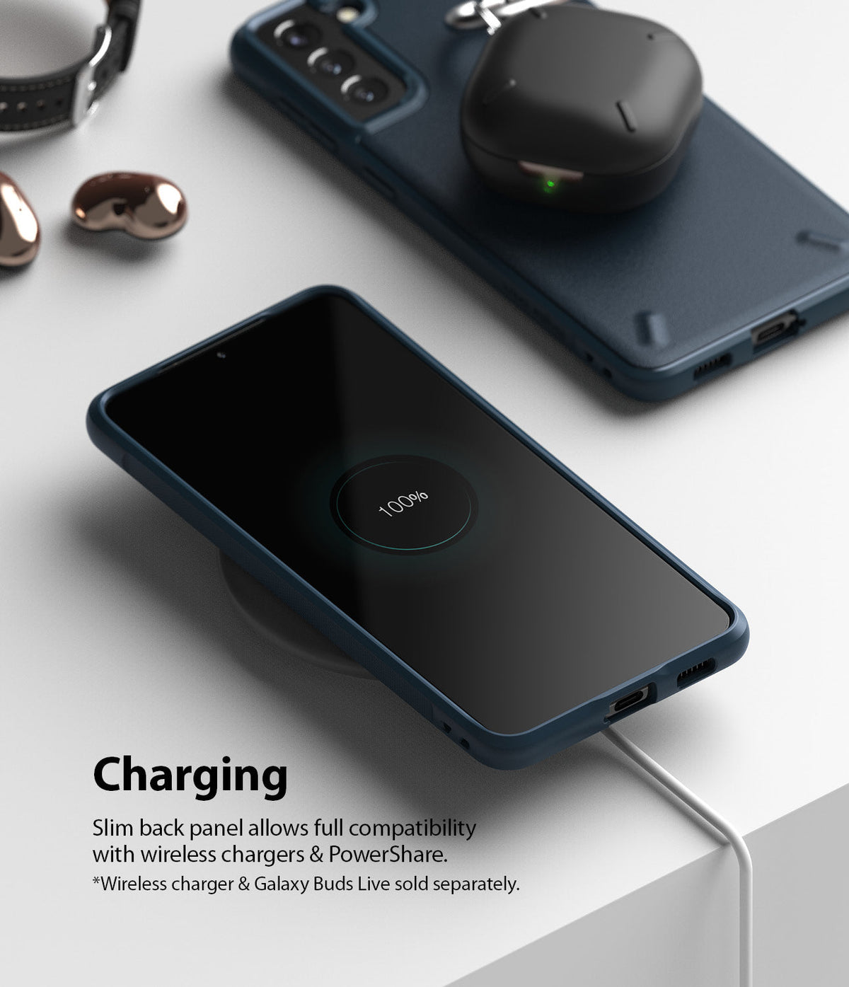 Galaxy S21 Plus Case | Onyx - A navy phone case on a wireless charger with 100% battery icon and earbuds charging on top.