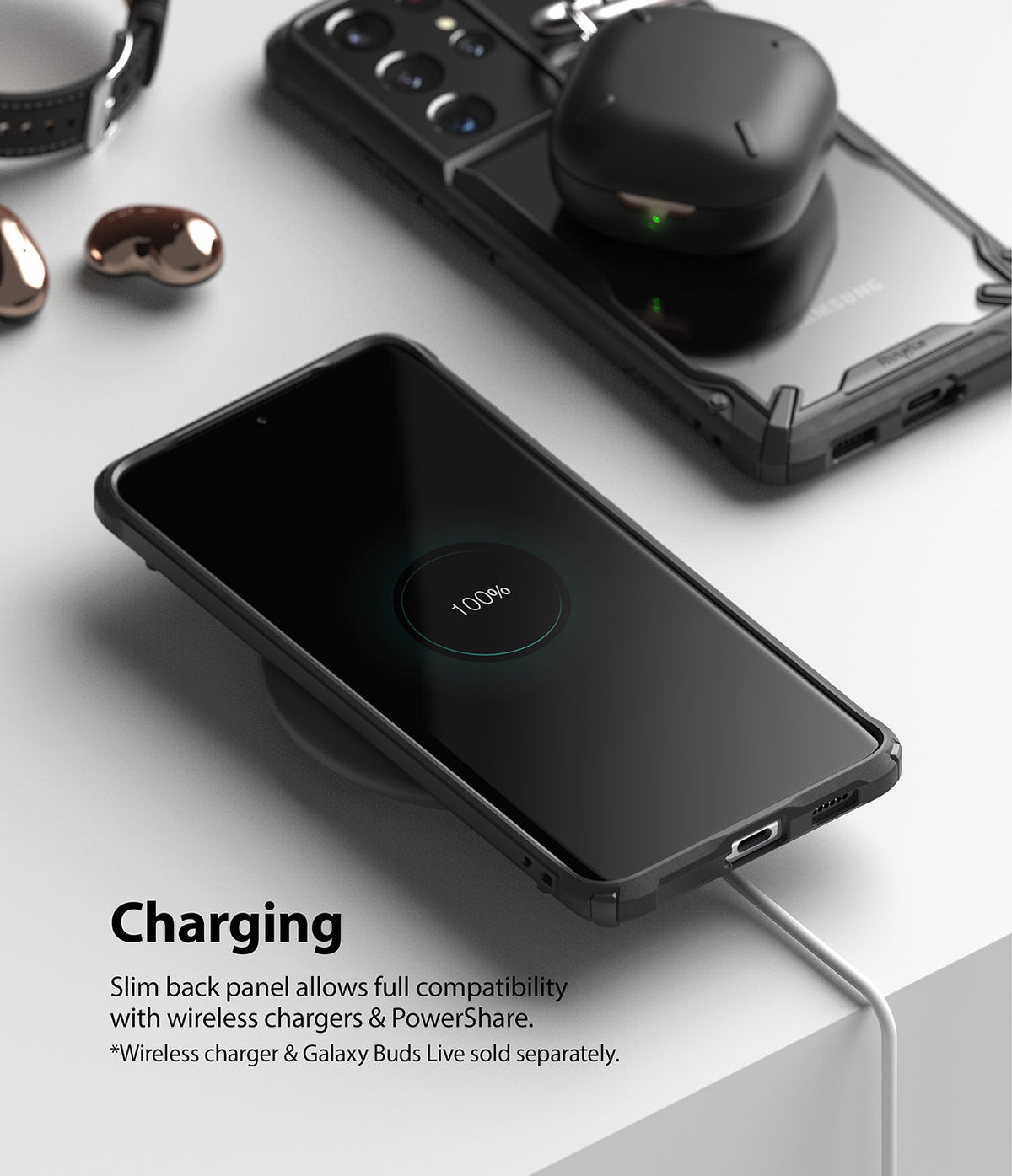 Galaxy S21 Ultra Case | Fusion-X - Phone in black case wirelessly charging on a pad with earbuds resting on another phone.