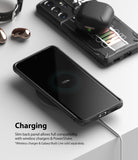 Galaxy S21 Ultra Case | Fusion-X Design - Phone in rugged case wirelessly charging with earbuds on a second device.
