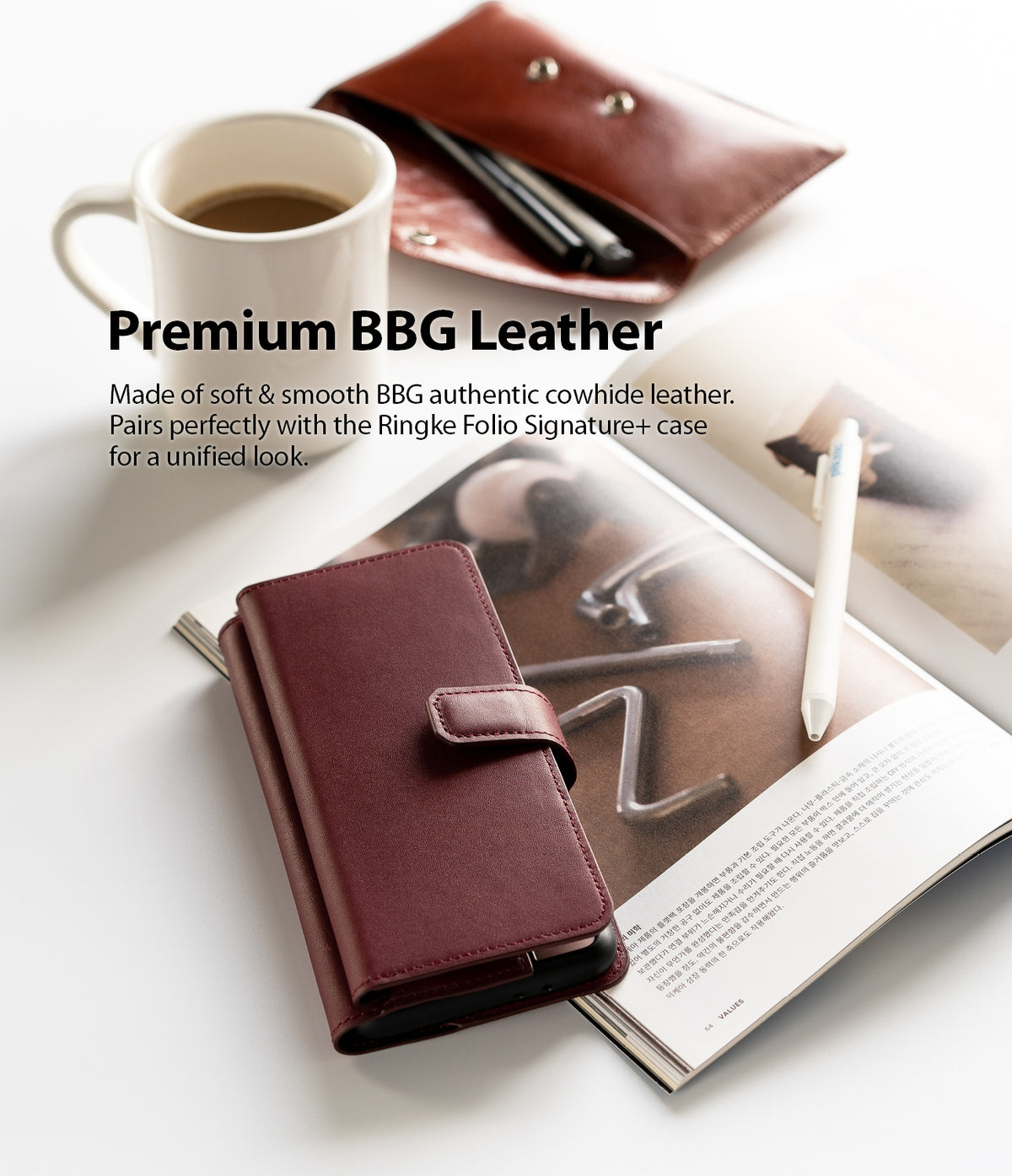 Galaxy S21 Plus Case | Folio Signature+ - Maroon leather folio phone case on an open book with a coffee mug and pen.